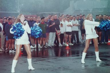 The girls limber up - the troops look stunned