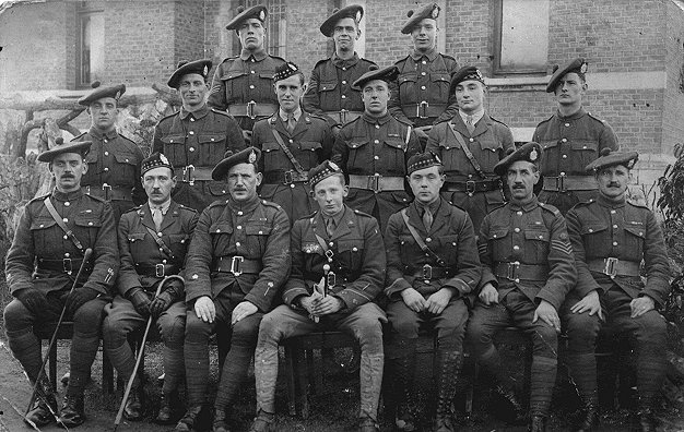 Gordon Llewellyn Griffiths (1888 - 1943) with a group of Cameron Highlanders. Middle row, centre wearing Glengarry